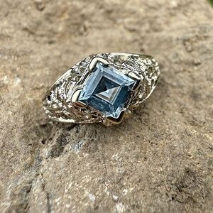 Vintage 14 Karat White Gold and Blue Topaz Ring with Intricate Design